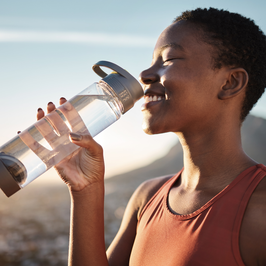 lady drinking water.png__PID:0f4feaf2-1fe4-4e37-a1e8-65d650598b2d