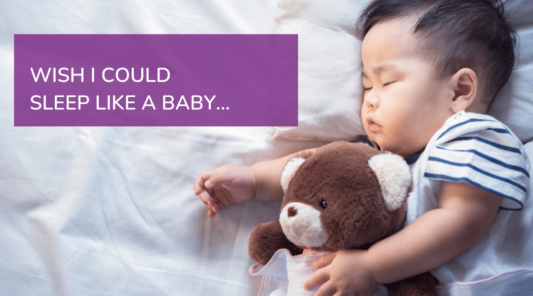 Image: Baby sleeping, cuddling a teddy bear. Test reads: WISH I COULD SLEEP LIKE A BABY.